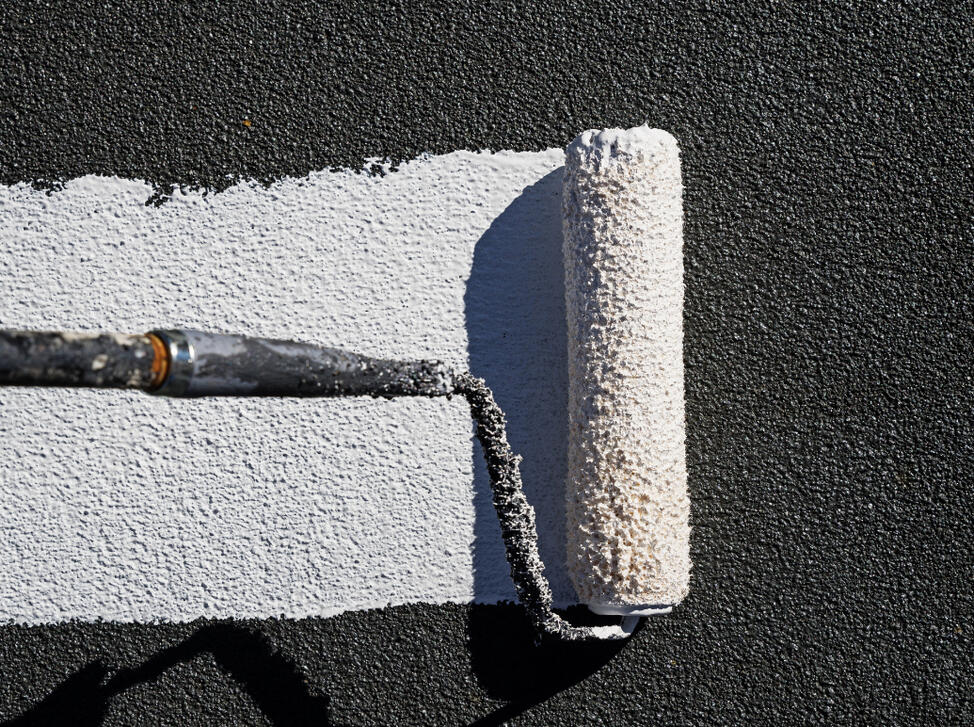 Paint roller applying a clean coat